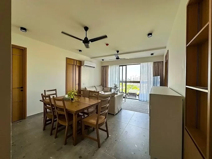 Fully furnished 3+1 bedroom luxury apartment in Solitaire, 8th Floor, Hulhumale'. A photo of the living area and dining area.