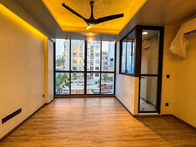 Brand new semi furnished 1 bedroom apartment on the 2nd floor of a residential building in Banafsaa Magu, Galolhu, Male'. A photo of the living area and dining area.