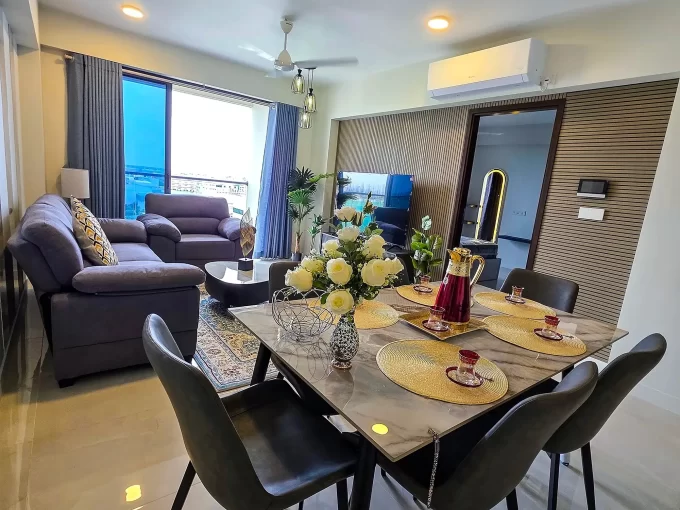 Fully furnished 3 bedroom luxury apartment in RainCoral Residence, 11th Floor, Hulhumale'. A photo of the living and dining area.